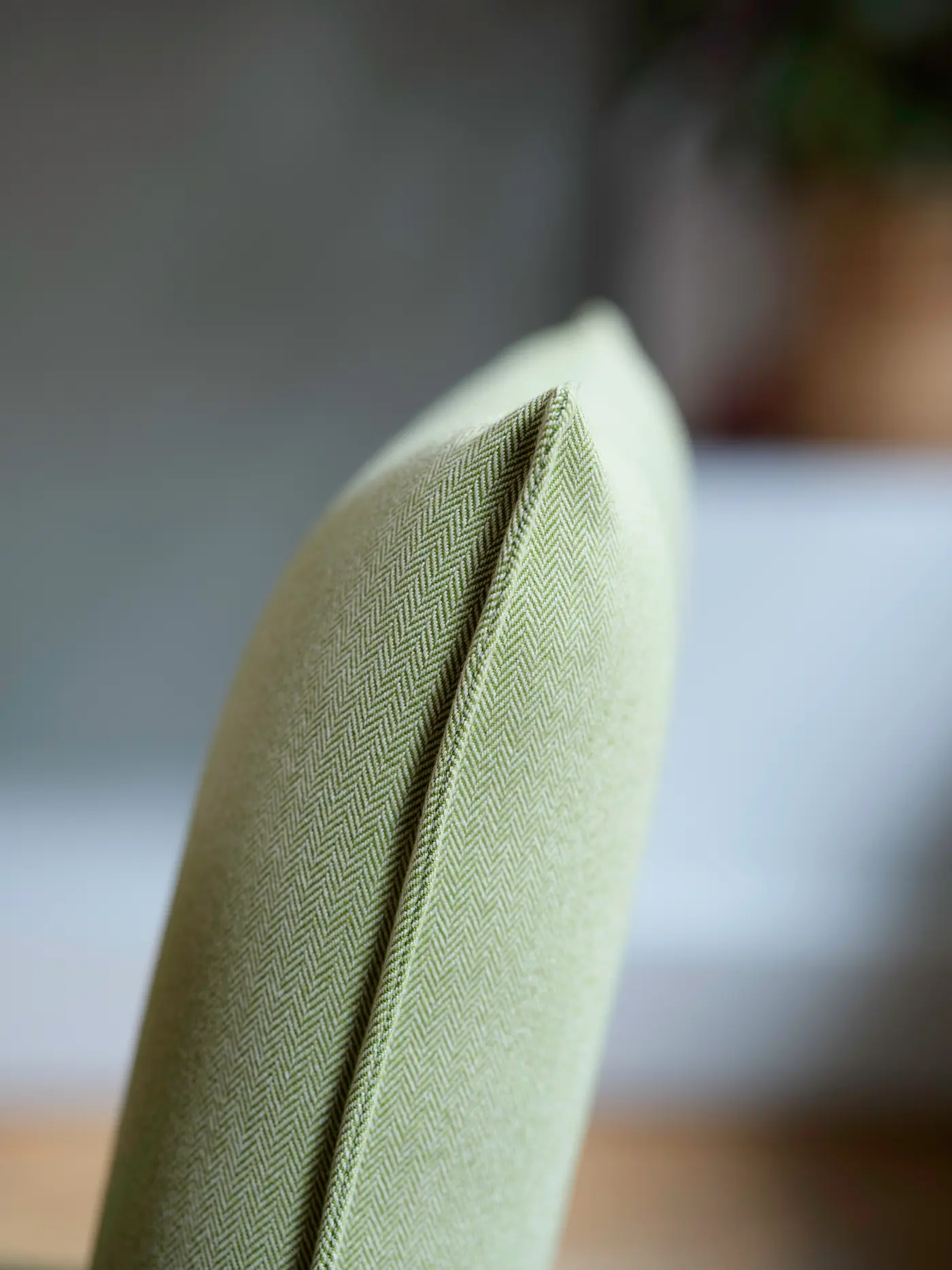 Courbe d’un coussin vert.